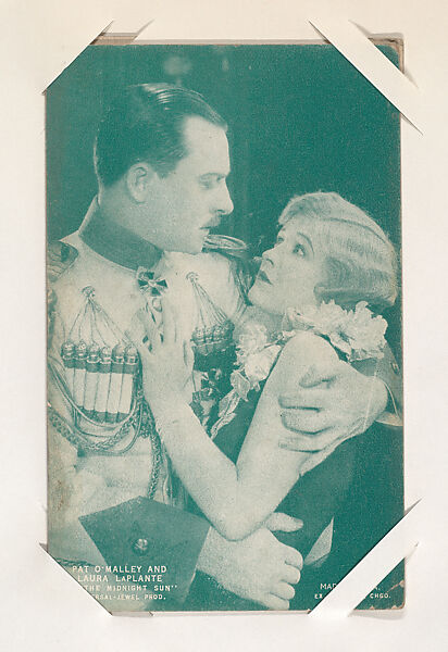 Pat O'Malley and Laura LaPlante in "The Midnight Sun" from Scenes from Movies Exhibit Cards series (W404), Exhibit Supply Company, Commercial color photolithograph 