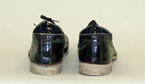 Athletic shoes, leather, rubber, probably American