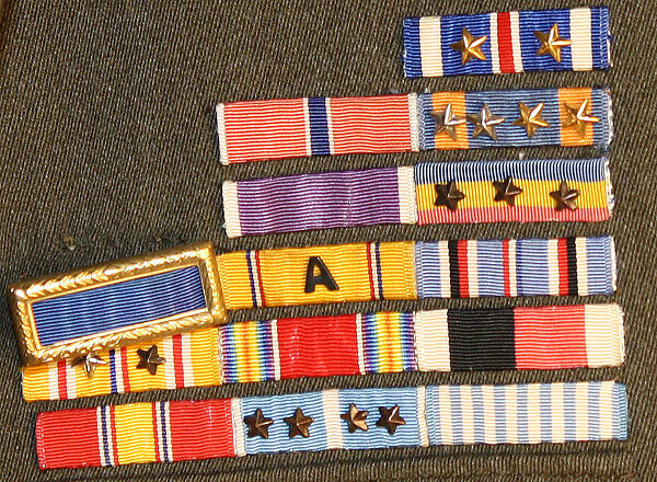 Military uniform, a, f, g, i, l, m) wool
b, c) silver
d, e, j, k, o, p, r, s) metal 
h, n, q) cotton, American