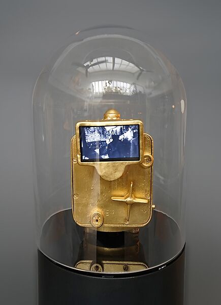 When All Roads Are One, Ghiora Aharoni (American, born Rehovot, Israel 1969), Single-channel digital video, black-and-white, 7 min., 46 sec.; gilded taxi meter, pedestal and vitrine