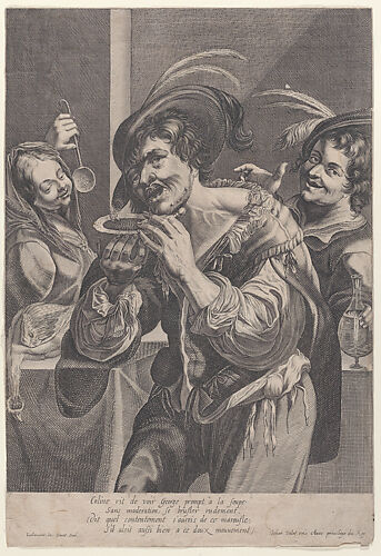 Man drinking soup while two people watch him