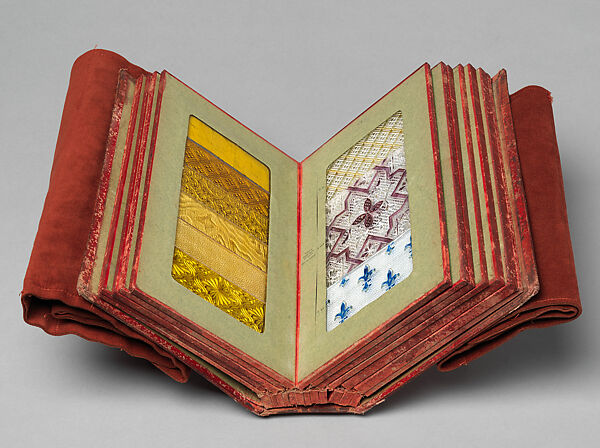 Album des principaux modeles de verres : produits spéciaux en verre coulé, Manufactures des glaces &amp; produits chimiques de Saint-Gobain, Chauny &amp; Cirey, Cloth cover binding. Twelve double boards cloth hinged with embedded glass samples 