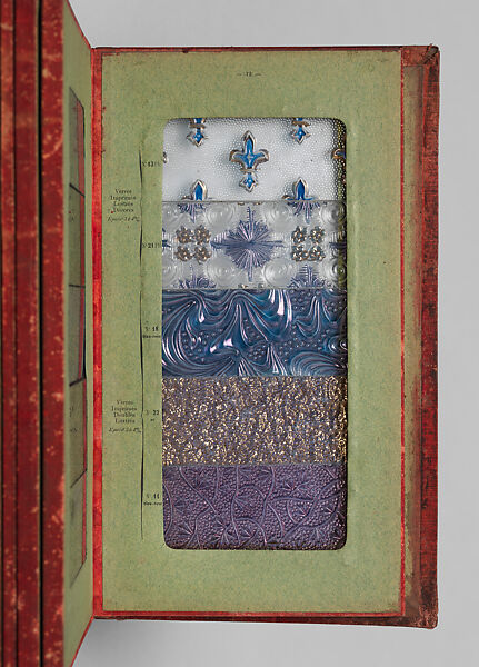 Album des principaux modeles de verres : produits spéciaux en verre coulé, Manufactures des glaces &amp; produits chimiques de Saint-Gobain, Chauny &amp; Cirey, Cloth cover binding. Twelve double boards cloth hinged with embedded glass samples