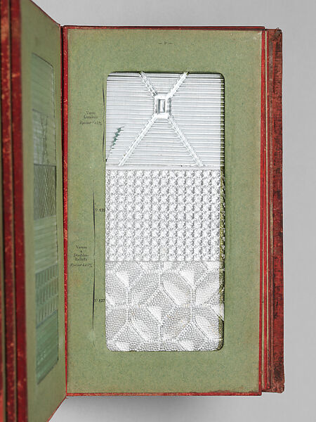 Album des principaux modeles de verres : produits spéciaux en verre coulé, Manufactures des glaces &amp; produits chimiques de Saint-Gobain, Chauny &amp; Cirey, Cloth cover binding. Twelve double boards cloth hinged with embedded glass samples