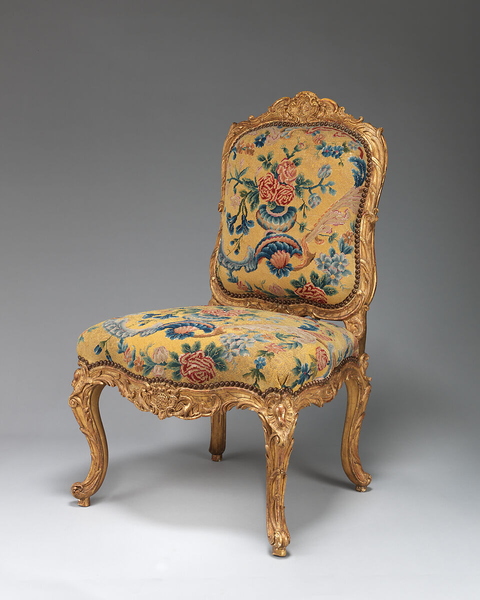 Chair (chaise à la Reine) (one of a set of four), Probably by Jean-Baptiste I Tilliard (French, 1686–1766), Beechwood unusually richly carved and gilded; previously upholstered with coral colored velvet attached with brass-headed nails, now upholstered in yellow petit point, French, Paris 