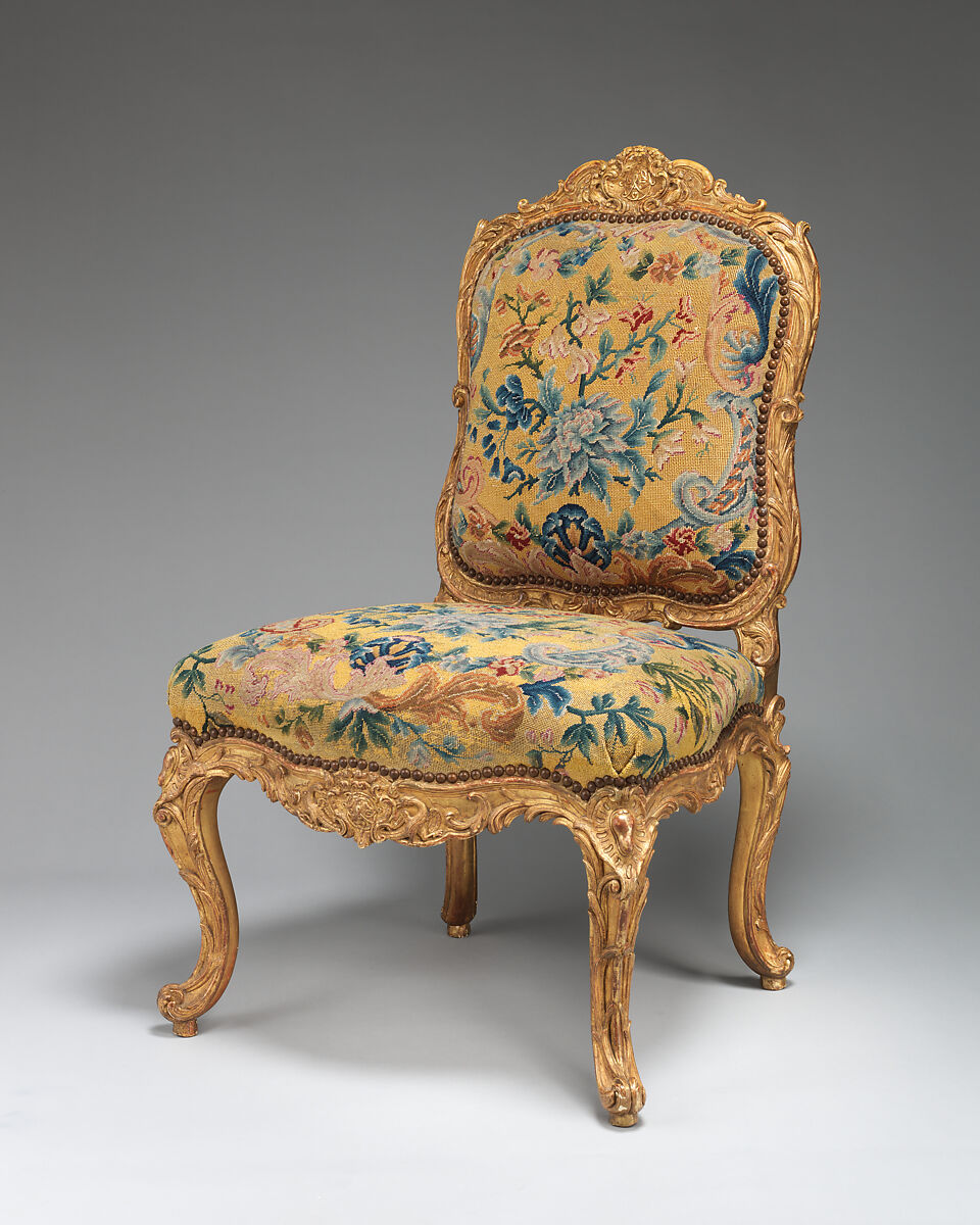 Chair (chaise à la Reine) (one of a set of four), Probably by Jean-Baptiste I Tilliard (French, 1686–1766), Beechwood unusually richly carved and gilded; previously upholstered with coral colored velvet attached with brass-headed nails, now upholstered in yellow petit point, French, Paris 