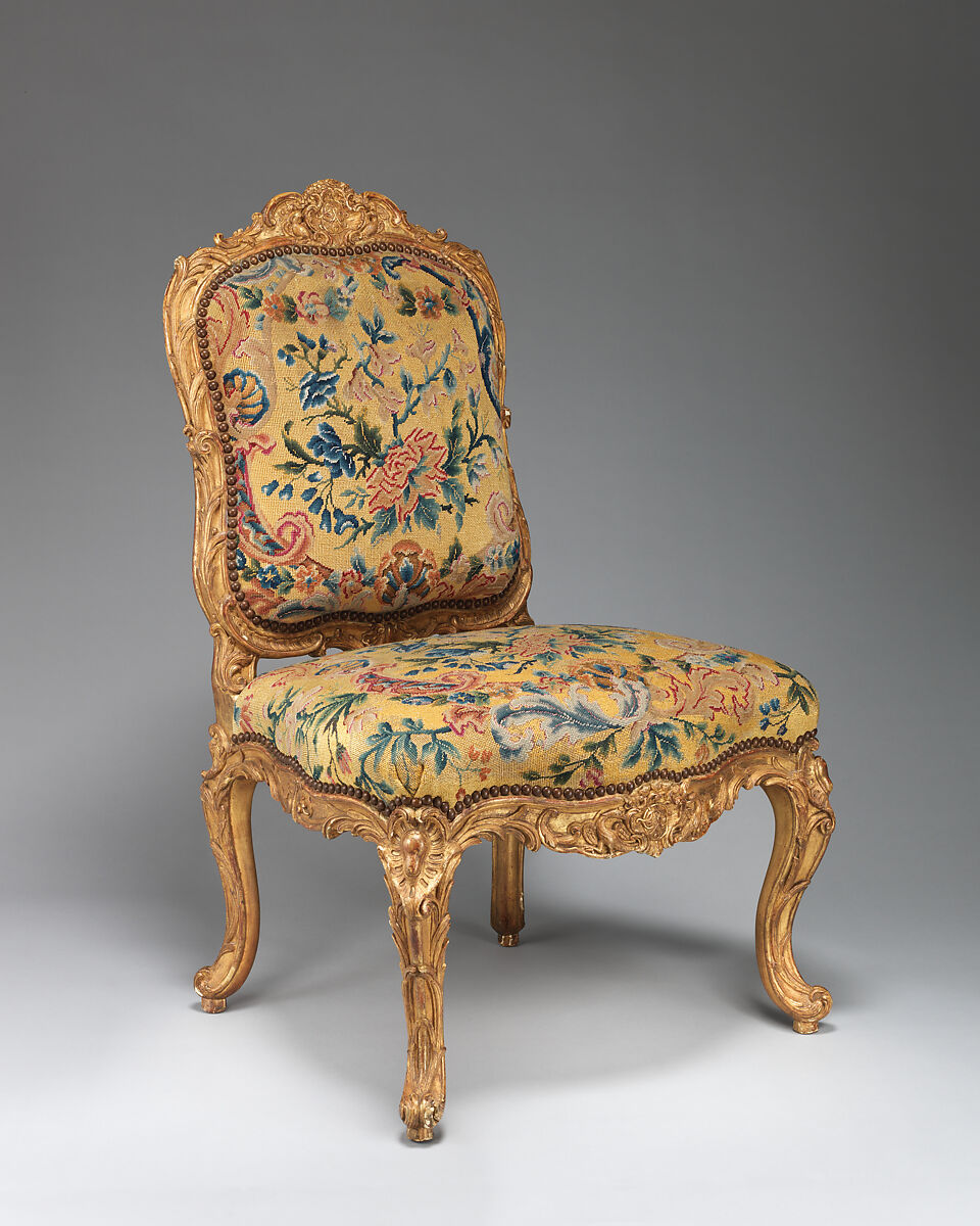 Chair (chaise à la Reine) (one of a set of four), Probably by Jean-Baptiste I Tilliard (French, 1686–1766), Beechwood unusually richly carved and gilded; previously upholstered with coral colored velvet attached with brass-headed nails, now upholstered in yellow petit point, French, Paris 