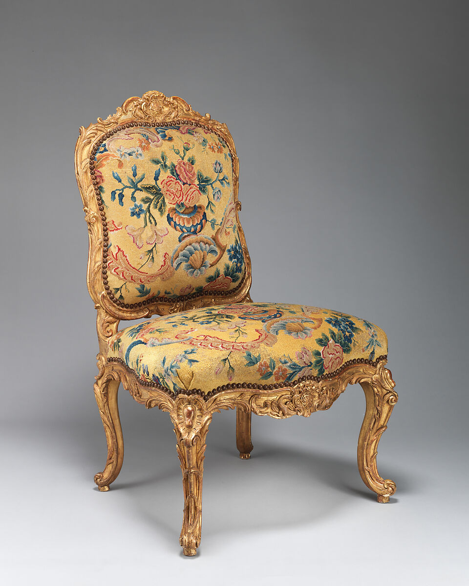 Chair (chaise à la Reine) (one of a set of four), Probably by Jean-Baptiste I Tilliard (French, 1686–1766), Beechwood unusually richly carved and gilded; previously upholstered with coral colored velvet attached with brass-headed nails, now upholstered in yellow petit point, French, Paris 