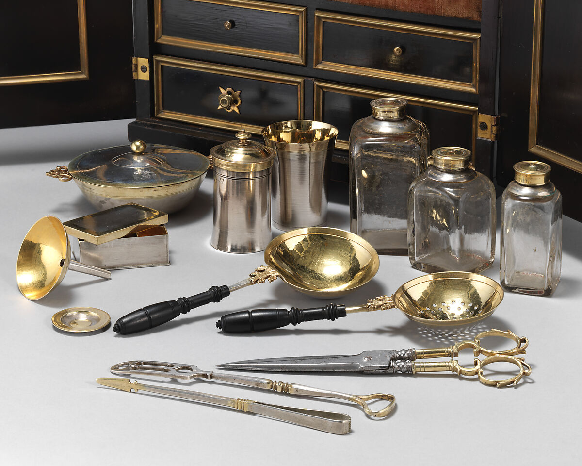 Apothecary Cabinet, Nicolaus I Kolb (German, master 1582–1621), Veneer: ebonized pearwood (Pyrus communis), ebony, partially gilded silver; carcass: conifer; interior: protective quilted cushion covered in red silk, drawers and chest lined with red silk velvet; gold trimming; mounts and fittings: partially gilded brass; thirty-two (32) vessels and utensils: glass, partially gilded silver, low carbon steel, leather, German, Augsburg