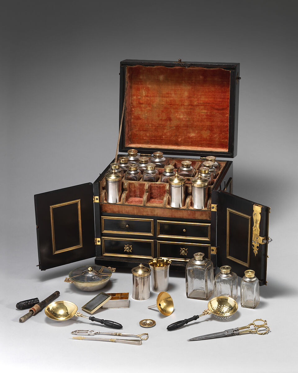 Apothecary Cabinet, Nicolaus I Kolb (German, master 1582–1621), Veneer: ebonized pearwood (Pyrus communis), ebony, partially gilded silver; carcass: conifer; interior: protective quilted cushion covered in red silk, drawers and chest lined with red silk velvet; gold trimming; mounts and fittings: partially gilded brass; thirty-two (32) vessels and utensils: glass, partially gilded silver, low carbon steel, leather, German, Augsburg 