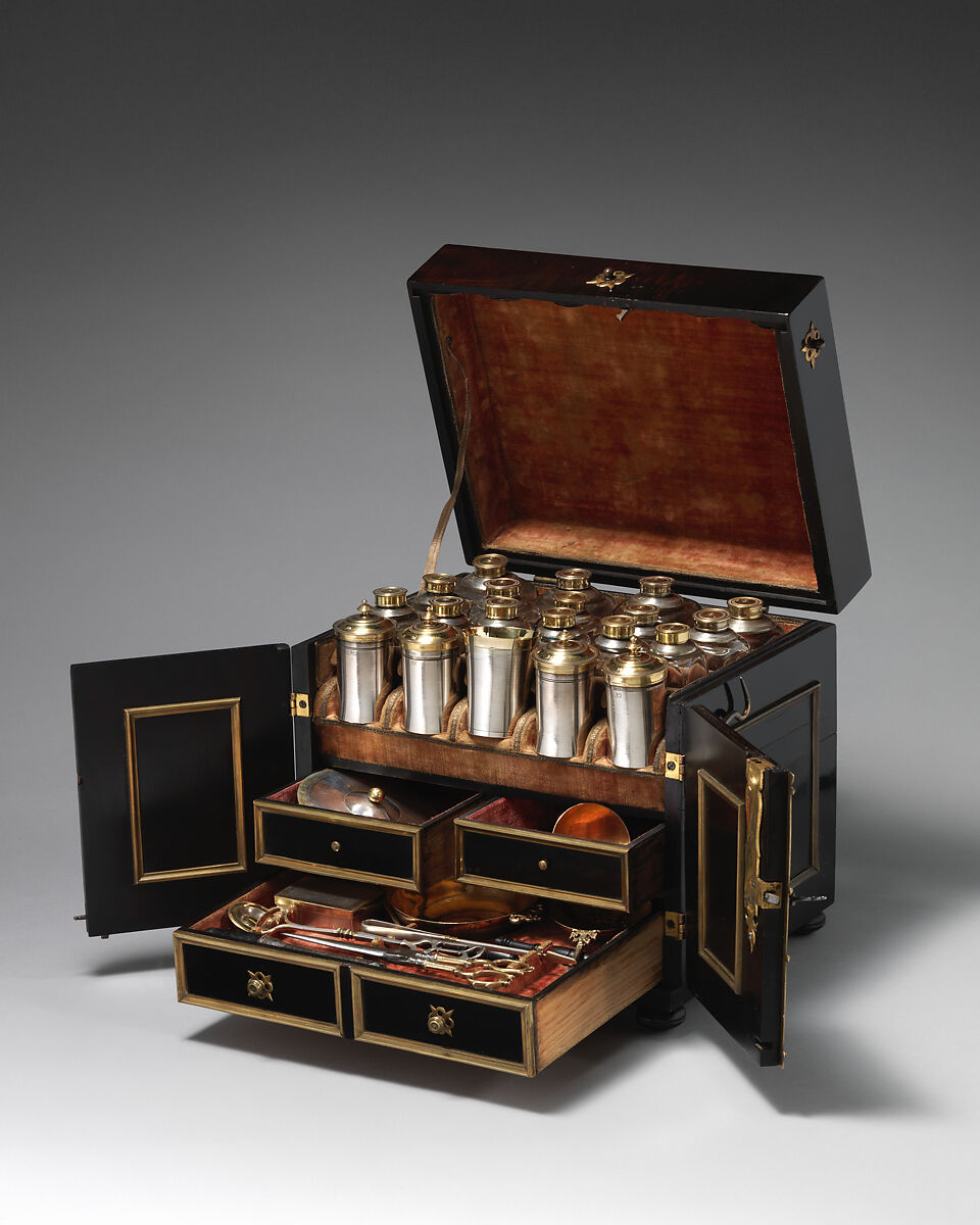 Apothecary Cabinet, Nicolaus I Kolb (German, master 1582–1621), Veneer: ebonized pearwood (Pyrus communis), ebony, partially gilded silver; carcass: conifer; interior: protective quilted cushion covered in red silk, drawers and chest lined with red silk velvet; gold trimming; mounts and fittings: partially gilded brass; thirty-two (32) vessels and utensils: glass, partially gilded silver, low carbon steel, leather, German, Augsburg