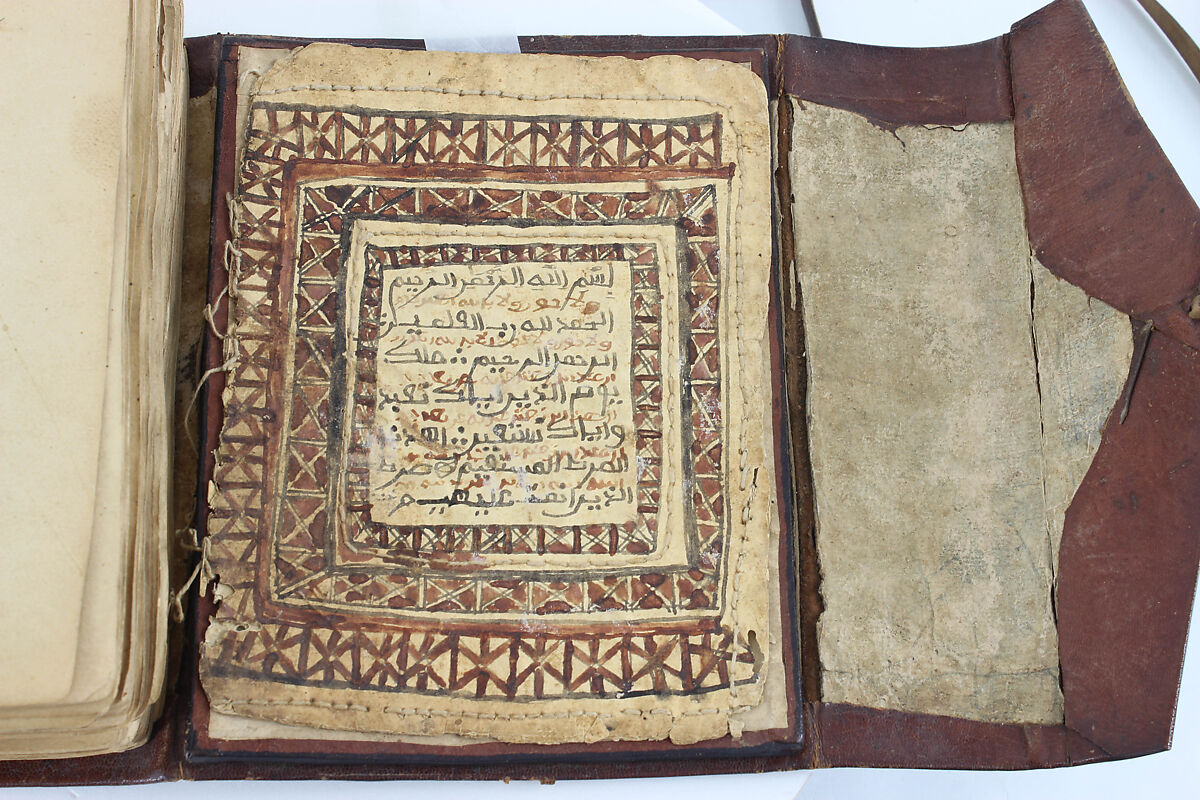 Qur'an, Ink and opaque watercolor on paper; embossed leather cover