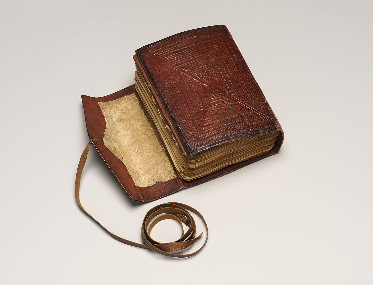 Qur'an, Ink and opaque watercolor on paper; embossed leather cover