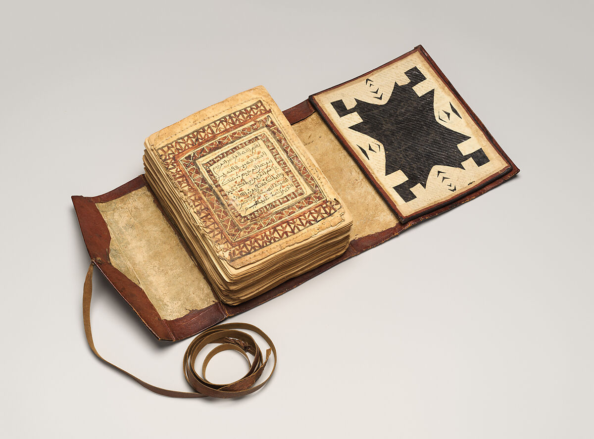 Qur'an, Ink and opaque watercolor on paper; embossed leather cover