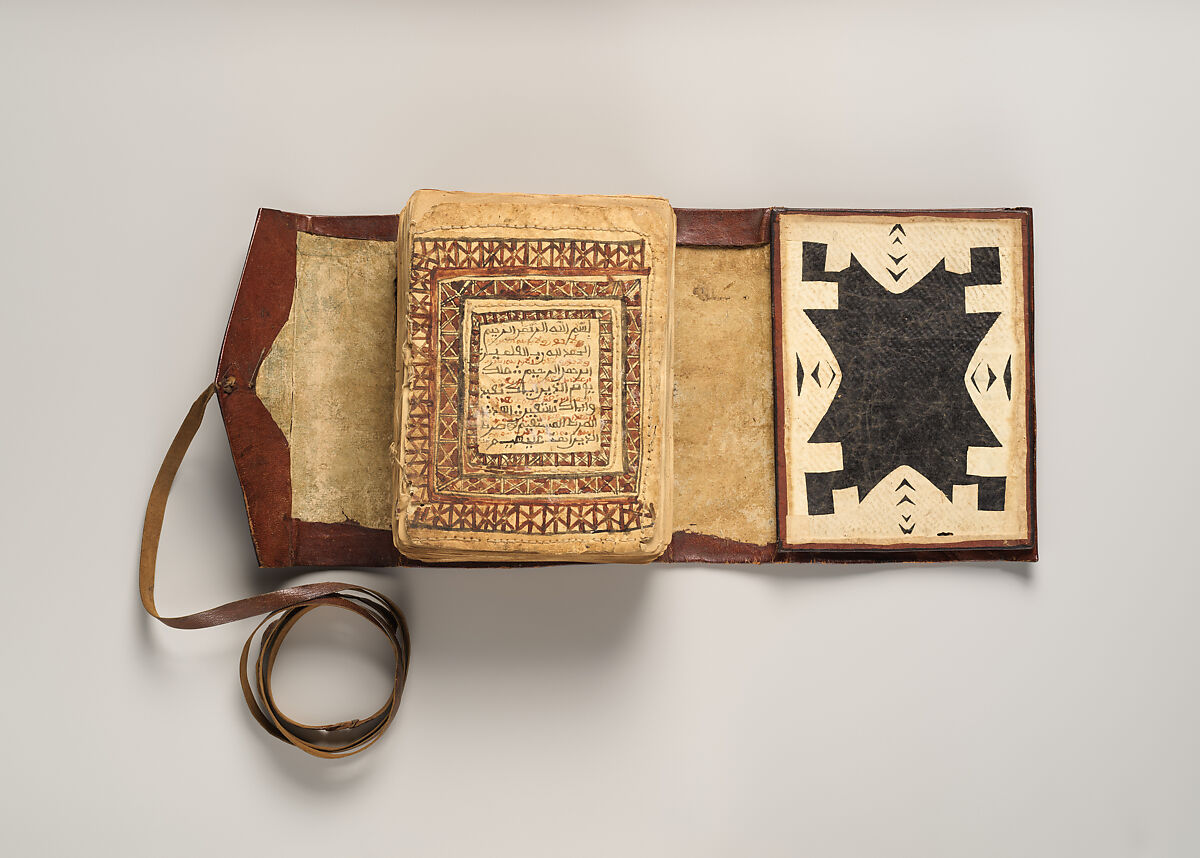 Qur'an, Ink and opaque watercolor on paper; embossed leather cover
