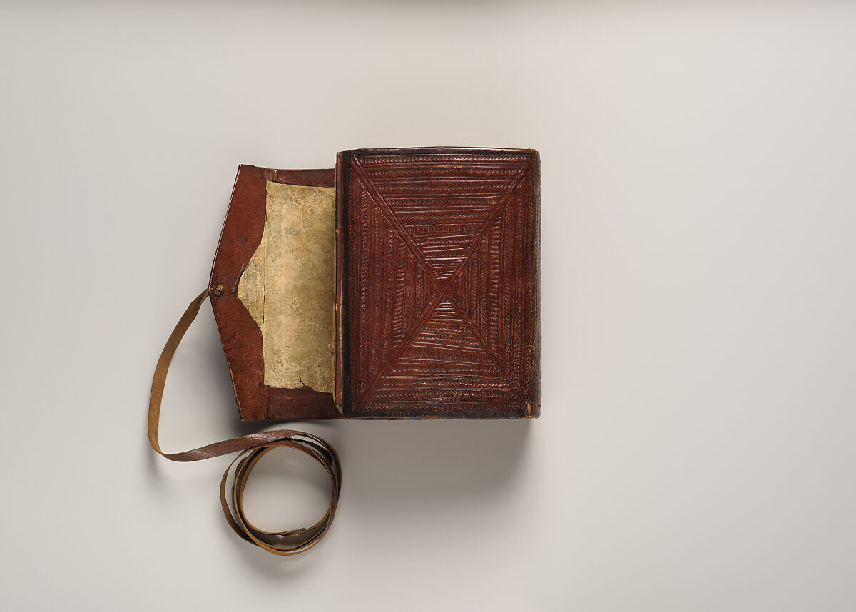 Qur'an, Ink and opaque watercolor on paper; embossed leather cover