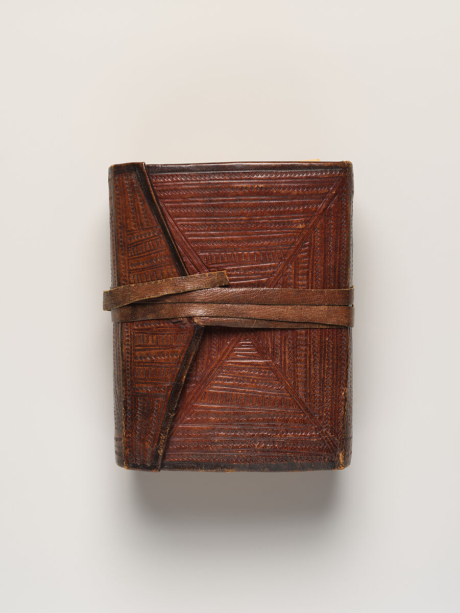 Qur'an, Ink and opaque watercolor on paper; embossed leather cover