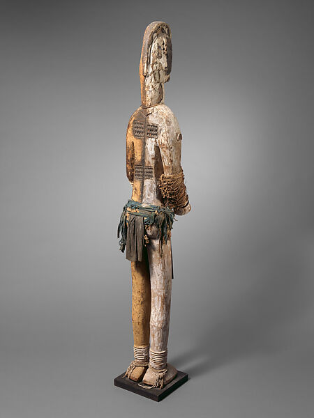 Male Figure, "Master of the Narrow Face" (active late 19th–early 20th century, Onitsha-Awka region, Nigeria), Wood, cotton cloth, pigment, plant fiber, metal, Igbo peoples
