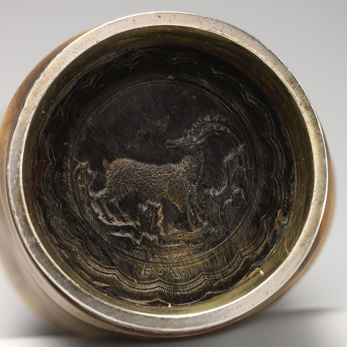 Ibex beaker with gilded silver mounts, Ibex horn, carved, turned and polished; gilded silver, etched, German, the mounts probably Salzburg
