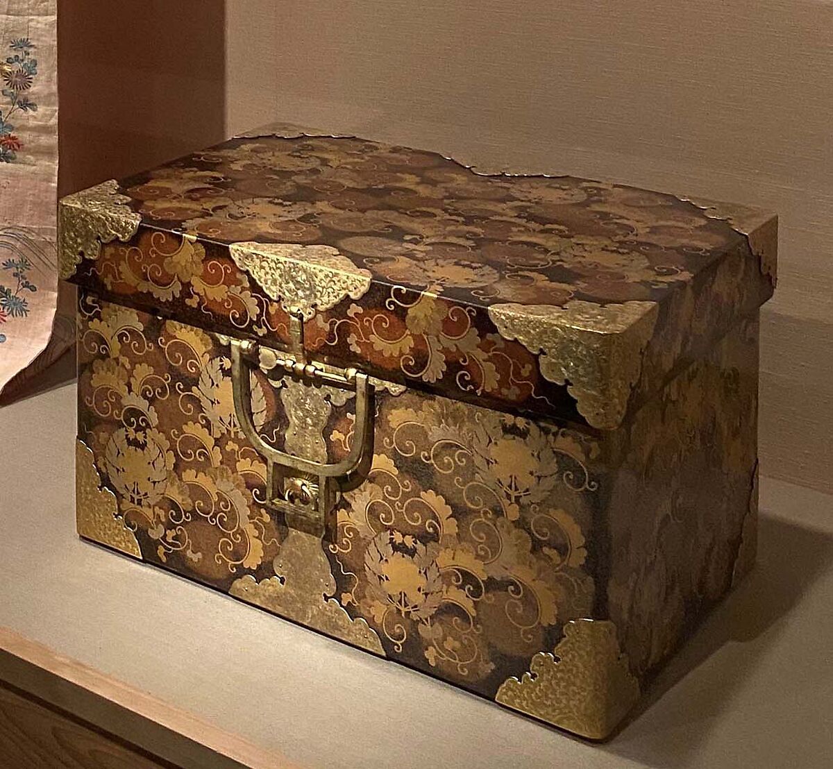 Storage Trunk (Nagamochi) with Family Crests, Pine, and Foliage Pattern, Lacquered wood with gold and silver takamaki‑e and hiramaki‑e on nashiji (“pear-skin” ground); gilded thread metal fittings, Japan 