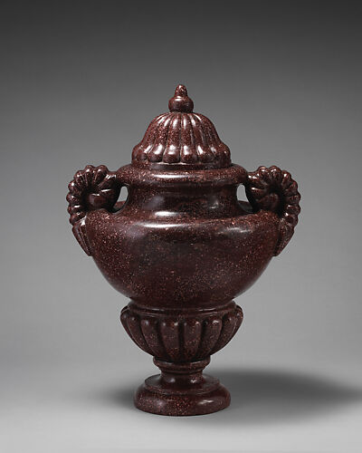 Urn with ram's horn handles and gadrooned lid and socle (one of a pair)