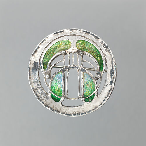 Round brooch with green enamel