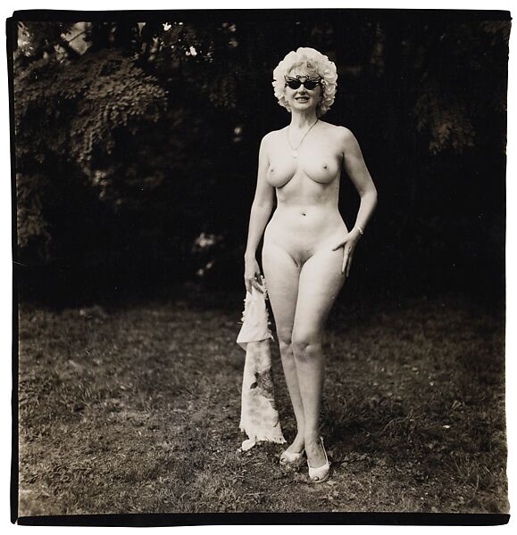 Nudist lady with swan sunglasses, Pa., Diane Arbus (American, New York 1923–1971 New York), Gelatin silver print 