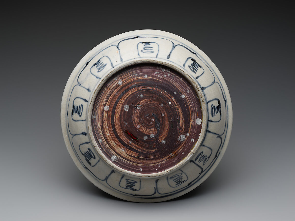 Dish with six-petalled flower design and floral scroll on cavetto, Stoneware painted with cobalt blue under a transparent glaze, Vietnam, probably Hai D’uong Province