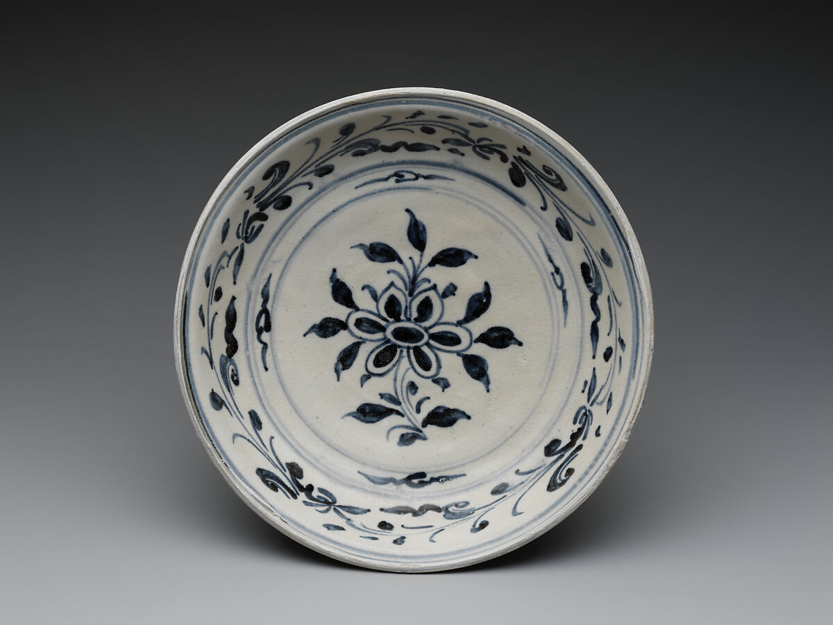 Dish with six-petalled flower design and floral scroll on cavetto, Stoneware painted with cobalt blue under a transparent glaze, Vietnam, probably Hai D’uong Province 