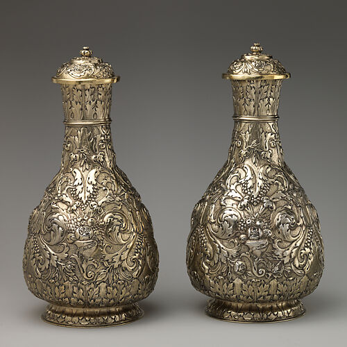 Bottle with cover (one of a pair)