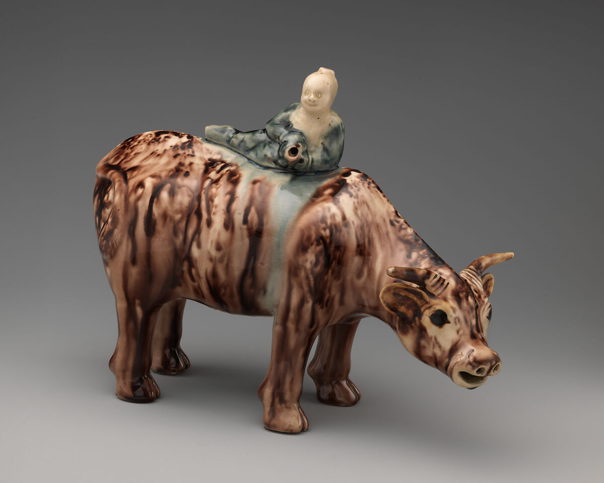 Water buffalo and reclining Chinese figure (one of a pair), Style of Whieldon type, Tortoiseshell ware (glazed earthenware), British, Staffordshire