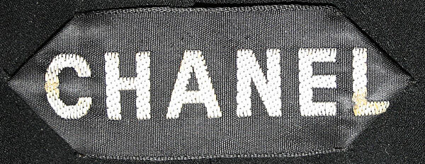 Evening ensemble, (a–c) House of Chanel (French, founded 1910), (a) wool, cotton; (b) gilt metal, rhinestones, faux pearls; (c) silk; (d, e) leather, silk, French