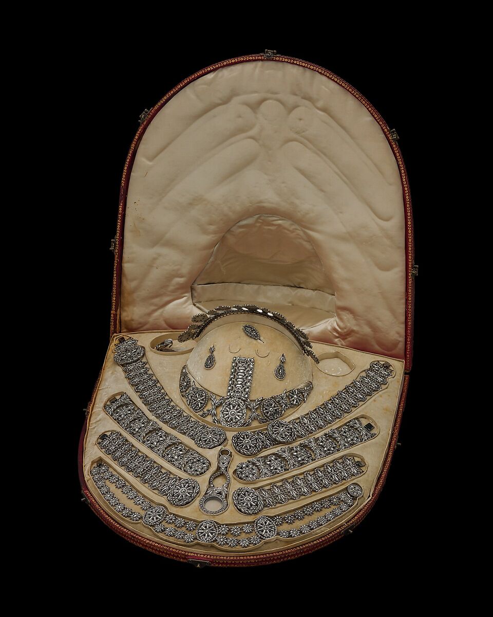 Fifteen-piece parure in leather case, Cut steel; red moroccan leather, gilt stamped, French