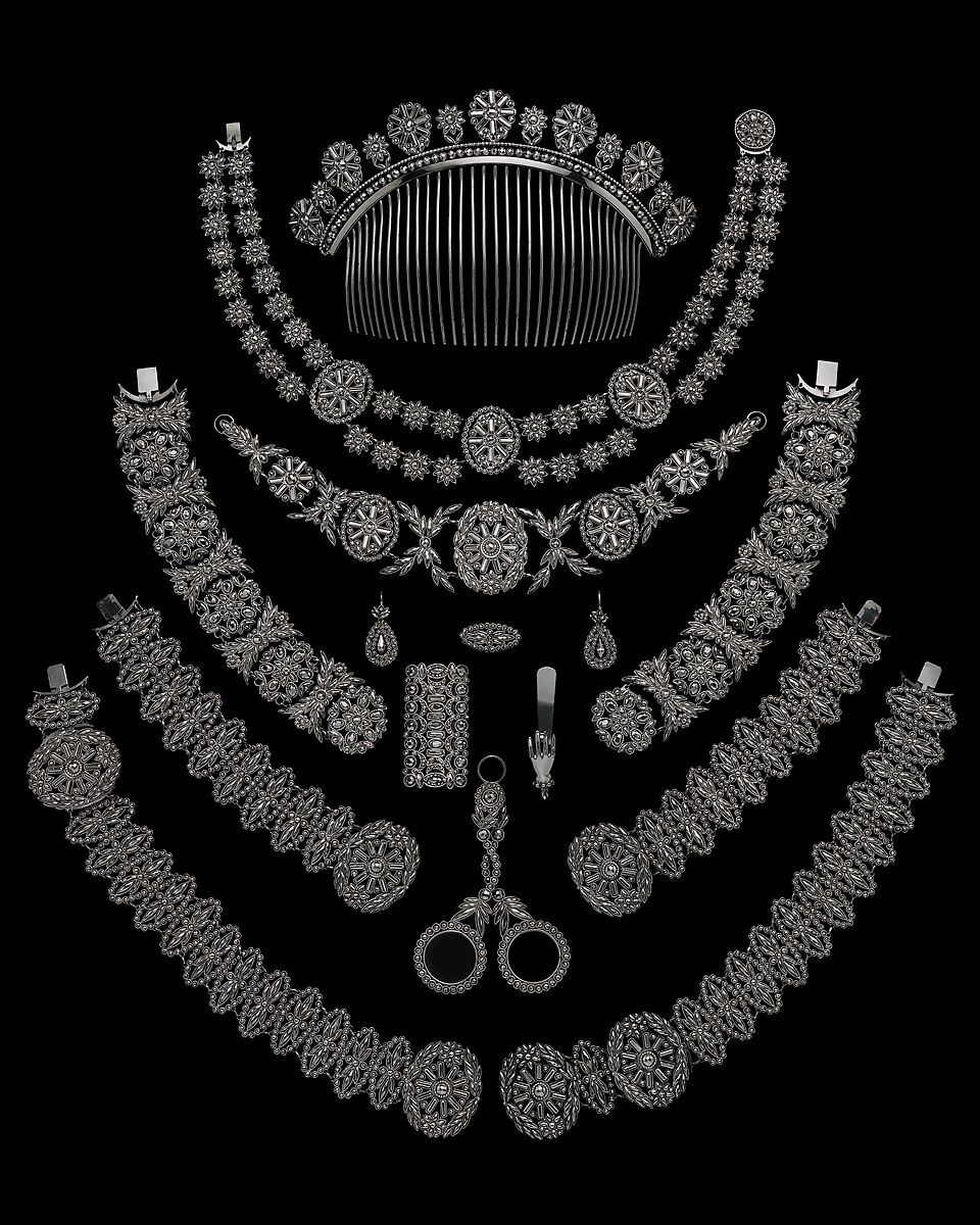 Fifteen-piece parure in leather case, Cut steel; red moroccan leather, gilt stamped, French