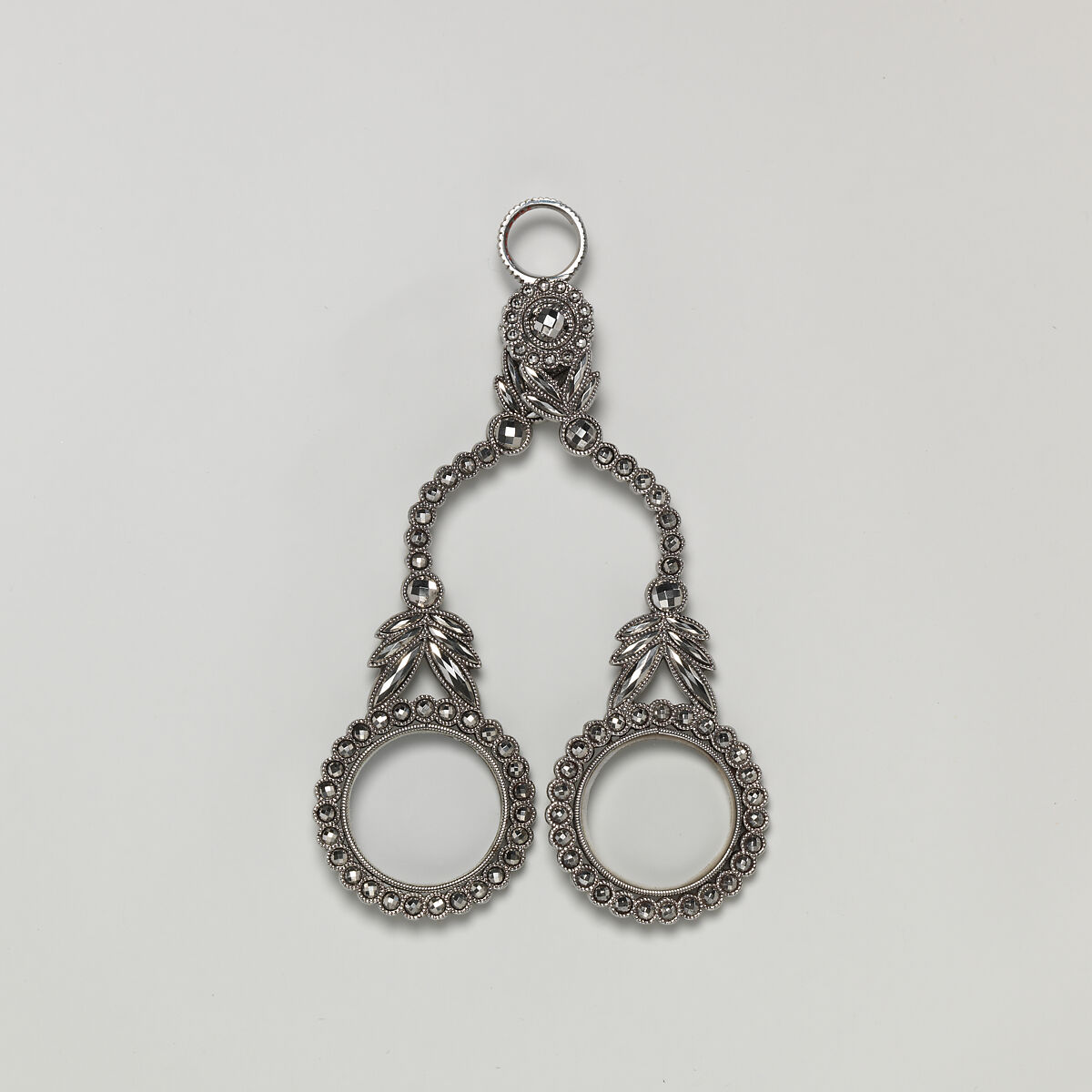 Fifteen-piece parure in leather case, Cut steel; red moroccan leather, gilt stamped, French