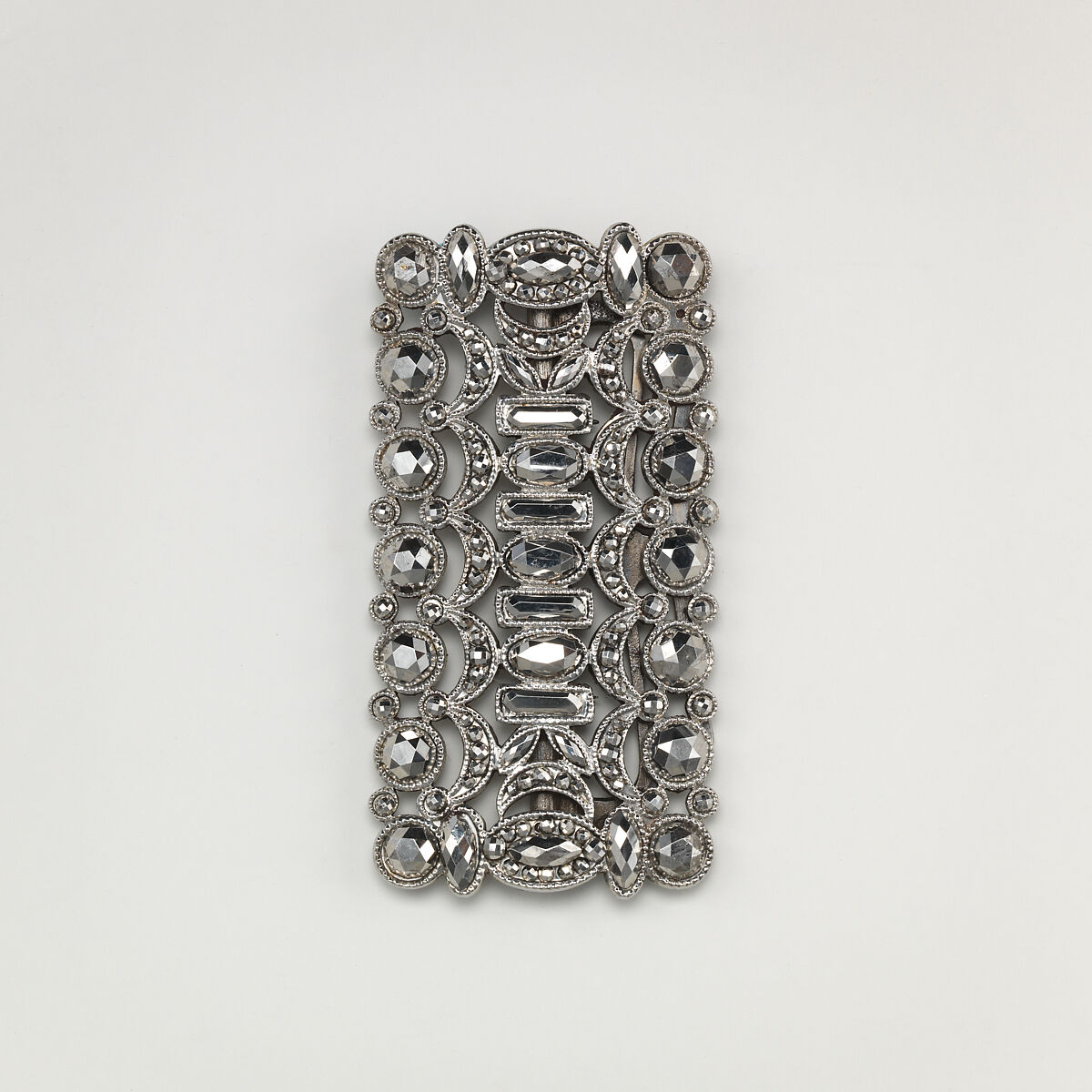 Fifteen-piece parure in leather case, Cut steel; red moroccan leather, gilt stamped, French