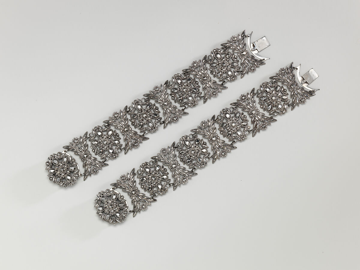 Fifteen-piece parure in leather case, Cut steel; red moroccan leather, gilt stamped, French