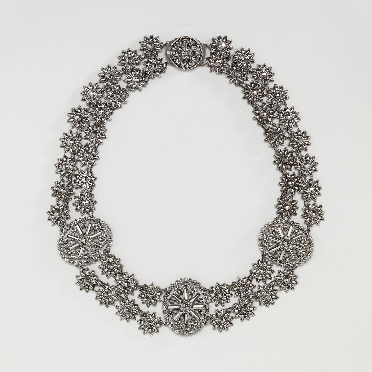 Fifteen-piece parure in leather case, Cut steel; red moroccan leather, gilt stamped, French