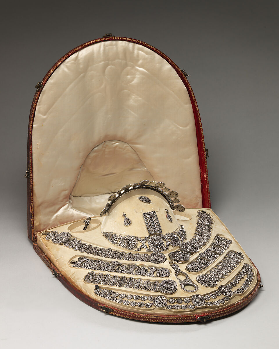 Fifteen-piece parure in leather case, Cut steel; red moroccan leather, gilt stamped, French