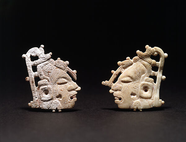 Pair of carved ornaments with the Maize God
, Shell, Maya