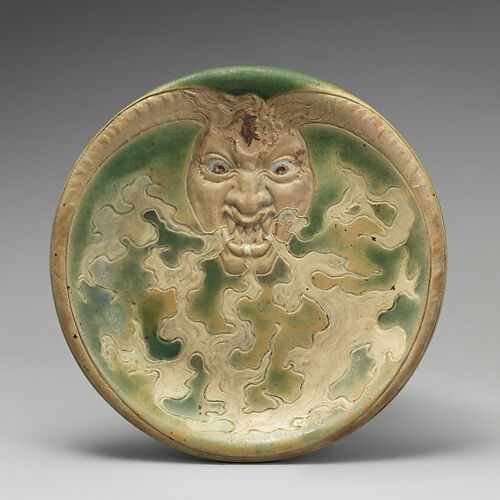 Dish with devil's head design
