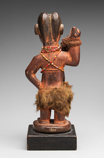 Female nkisi (power figure), Kongo artist and nganga (ritual specialist), Wood, resin, glass, pigment, cloth, fur, string, Kongo peoples