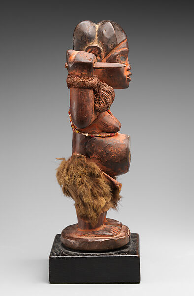 Female nkisi (power figure), Kongo artist and nganga (ritual specialist), Wood, resin, glass, pigment, cloth, fur, string, Kongo peoples