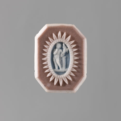 Putto with cornucopia at column