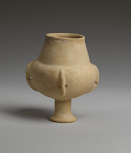 Marble vase with high foot and lug handles