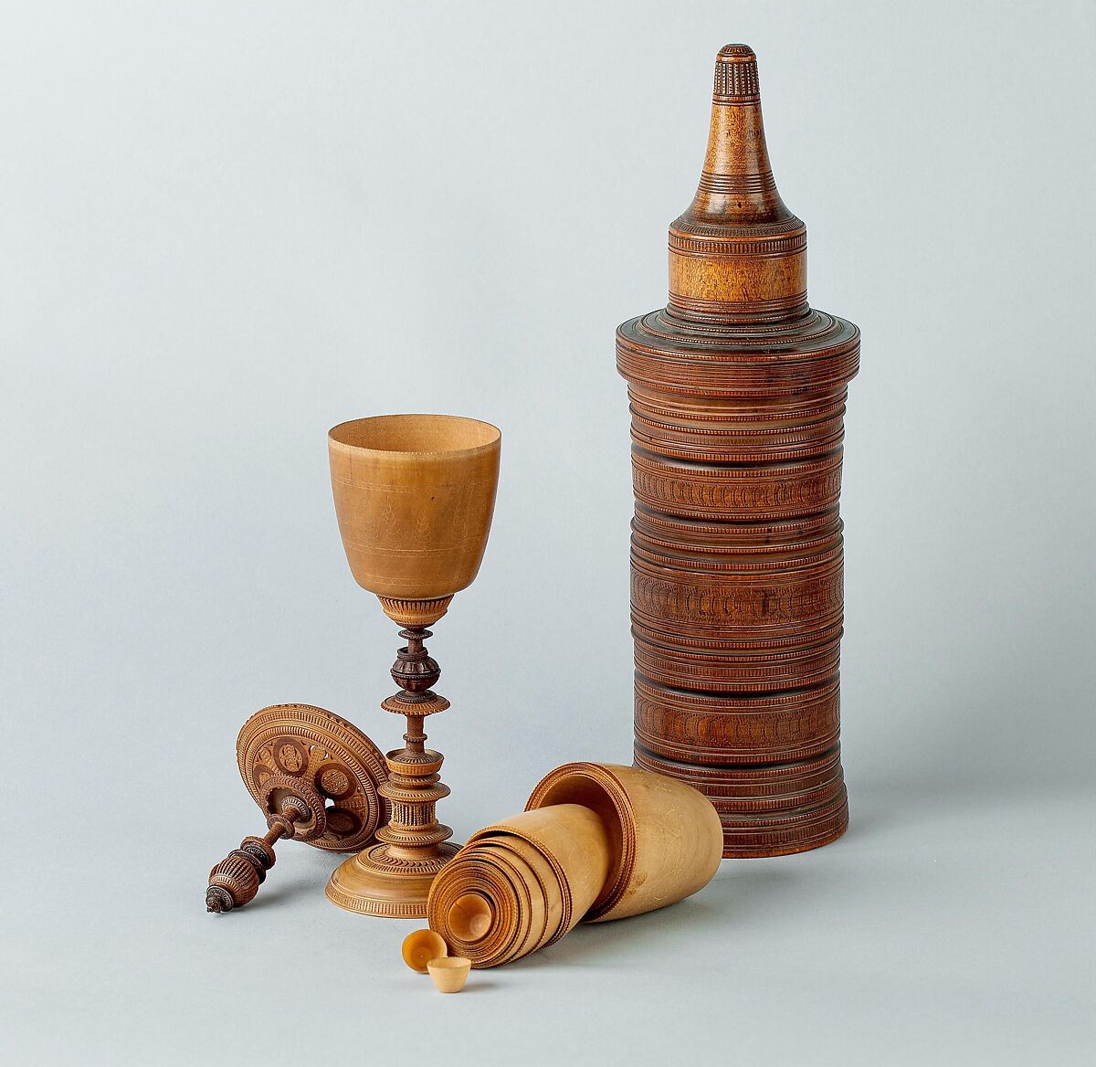 Turned cup and cover with inserts and original case, Unidentified turner, Berchtesgaden, Turned, carved, and stippled maple and plum, partly stained, German, Berchtesgaden