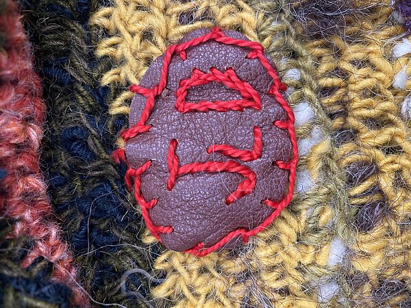 "African Mask", Janet Lipkin, a) wool, leather, wood
b-e) wool, leather, American