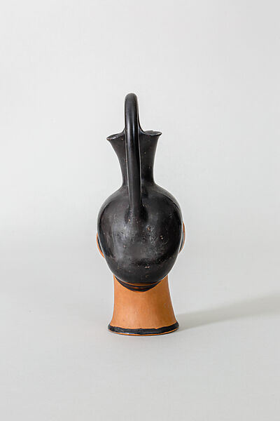 Oinochoe in the form of a woman's head, Class S: The Canessa Class of Head Vases, Terracotta, Greek