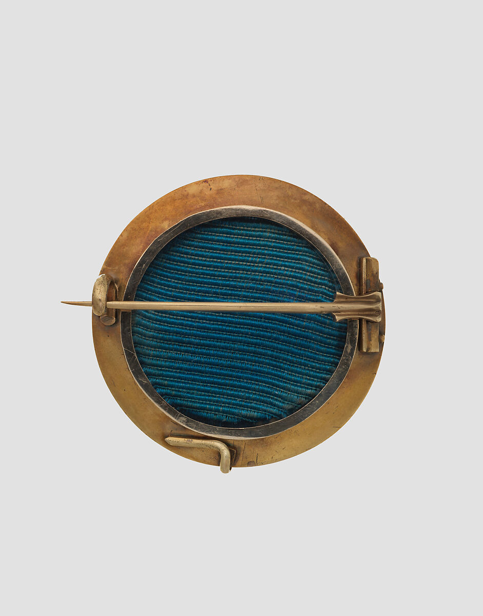 Brooch with Assyrian winged human-headed bull, Gold, glass, British