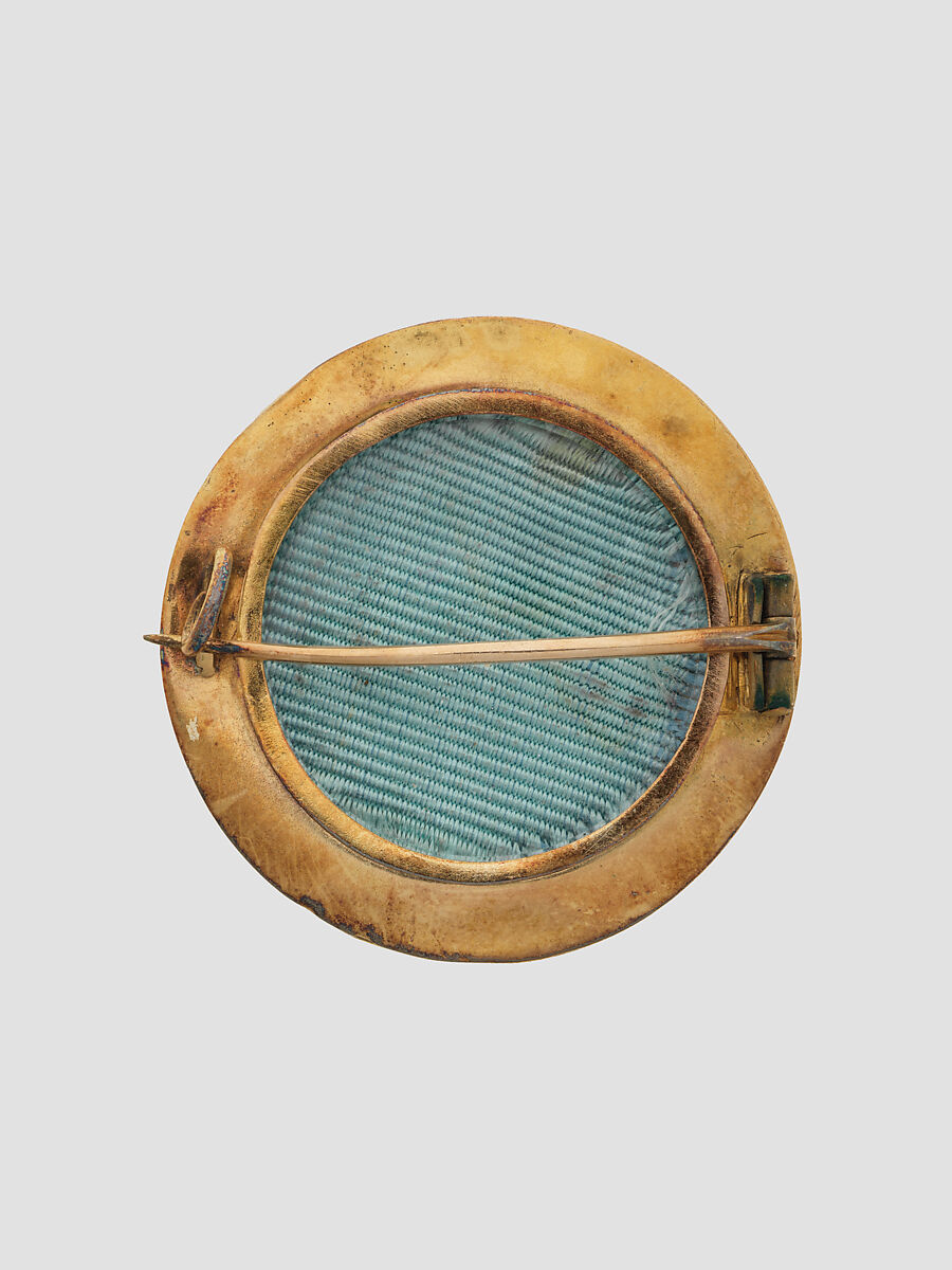 Brooch with Assyrian human-headed winged lion, Gold, enamel, British